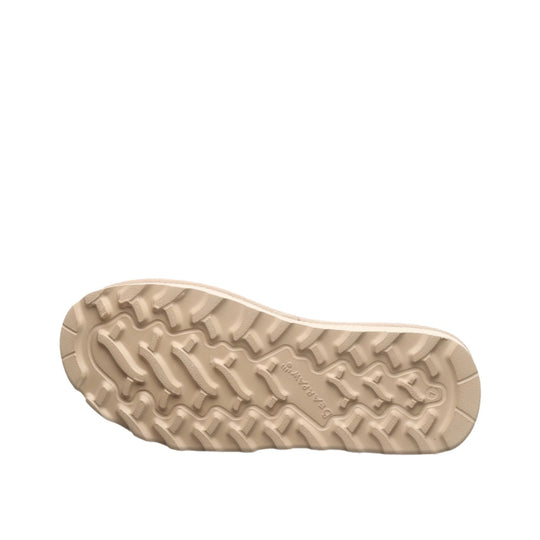 Beige boot outsole with rugged tread pattern