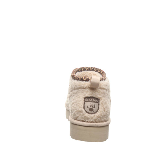 Cream sherpa ankle boot with tan sole and BEARPAW patch