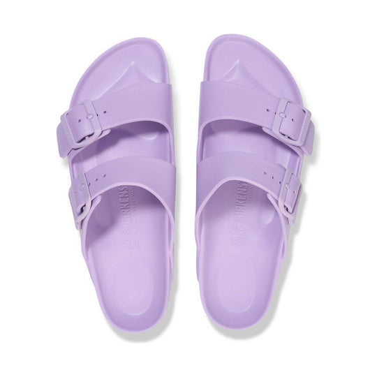 Lavender double-strap slip-on sandals with buckle details, shown from the top