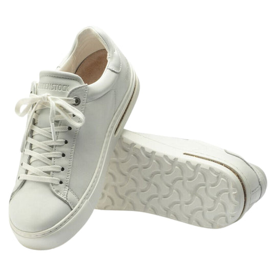 White leather lace-up sneaker pair with textured rubber sole, shown from top and side views