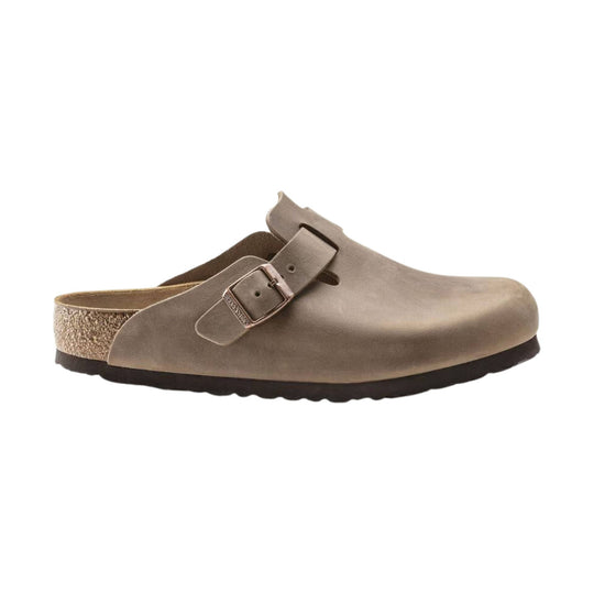 Taupe suede clog with an adjustable buckle strap and cork sole