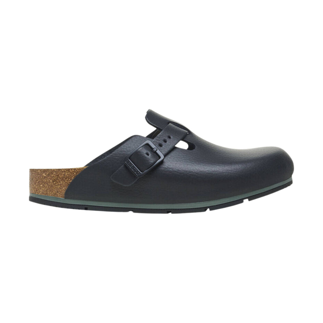 Black slip-on clog with a strap and buckle, cork heel, and rounded toe