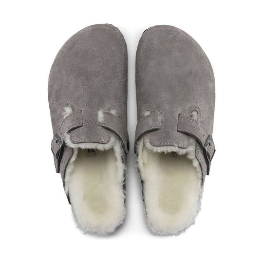 Gray suede shearling-lined clogs with buckle straps, top view