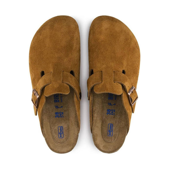 Brown suede clog sandals with two buckled straps and cork footbeds, top view