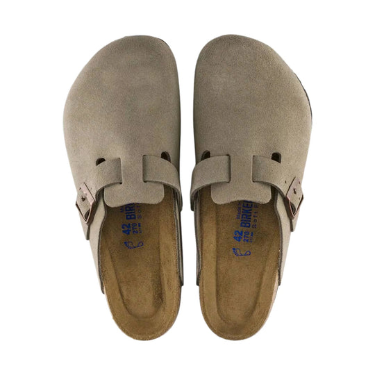 Pair of taupe suede clogs with adjustable side buckles, top view