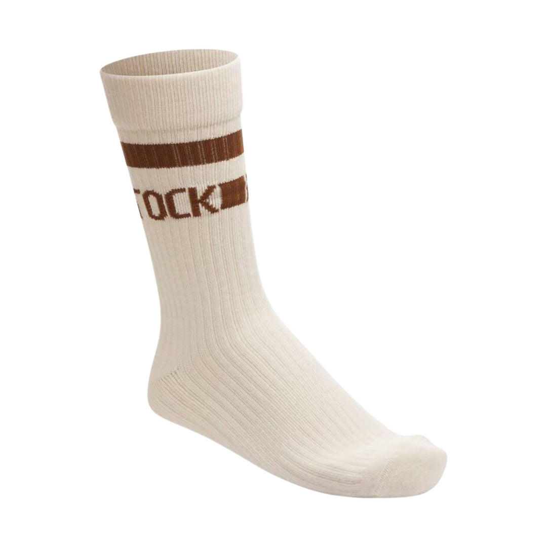 Cream crew sock with brown stripes and partial "OCK" text