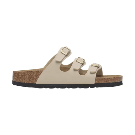 Beige three-strap cork footbed sandal with buckles and black sole