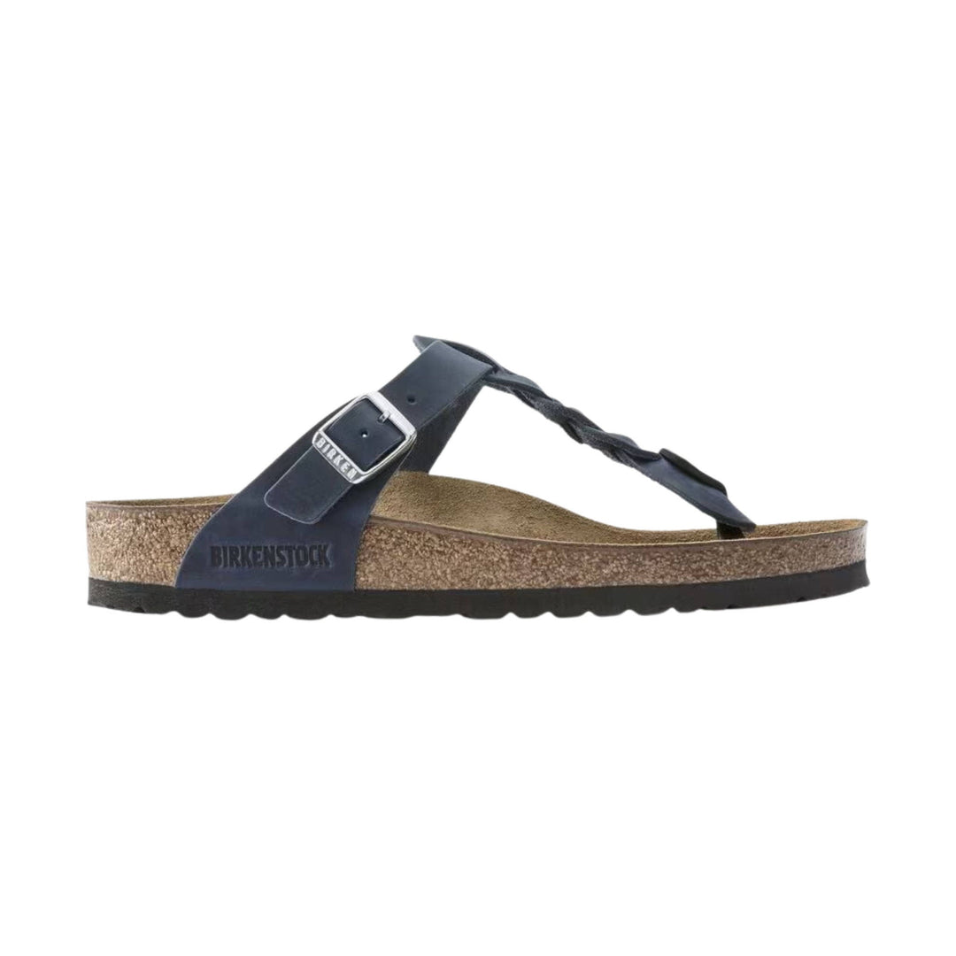 Navy leather thong sandal with braided toe strap, adjustable buckle, and cork footbed