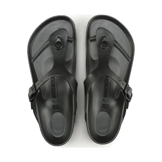 Pair of dark gray thong sandals with molded footbeds and side buckles