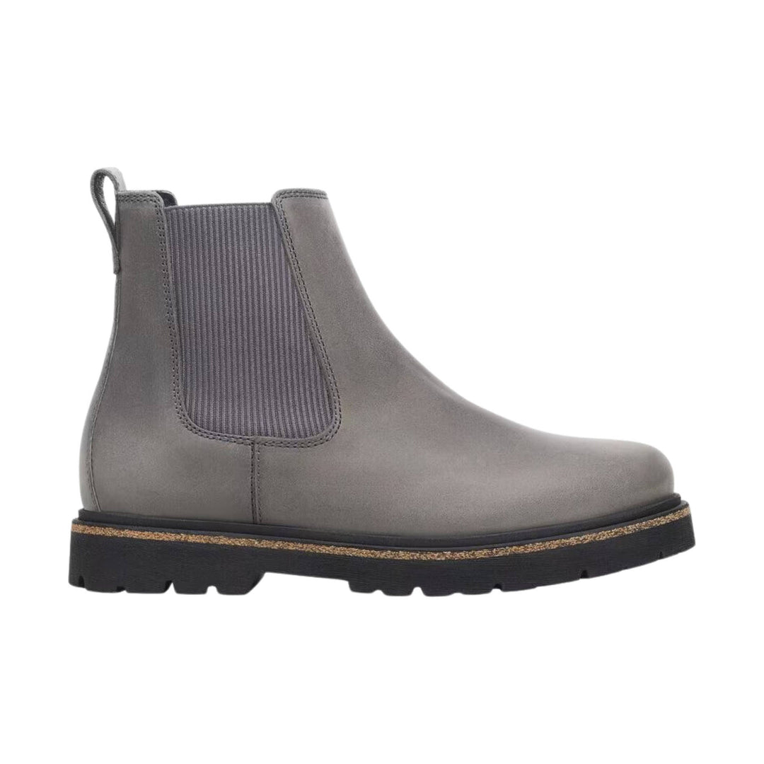 Gray ankle boot with elastic side panel, pull tab, and lug sole
