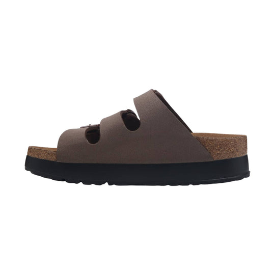 Brown platform slide sandal with three cutout straps, cork footbed, and black sole