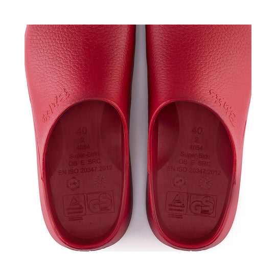 Pair of red molded clogs viewed from above, with size and certification markings inside