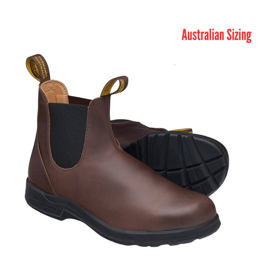 Brown Chelsea boot with black elastic side panels and pull tabs, shown with sole view.