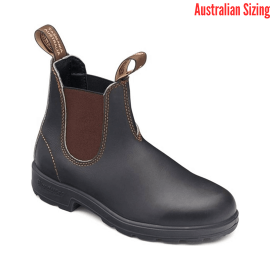 Black leather boot with brown patch on a white background