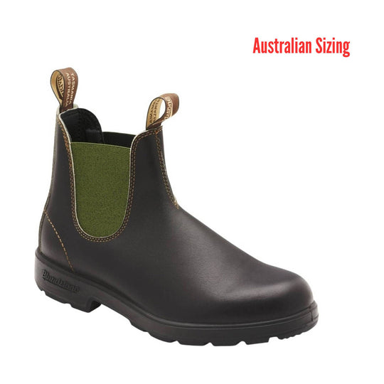 brown Chelsea boot with green lining on a white background