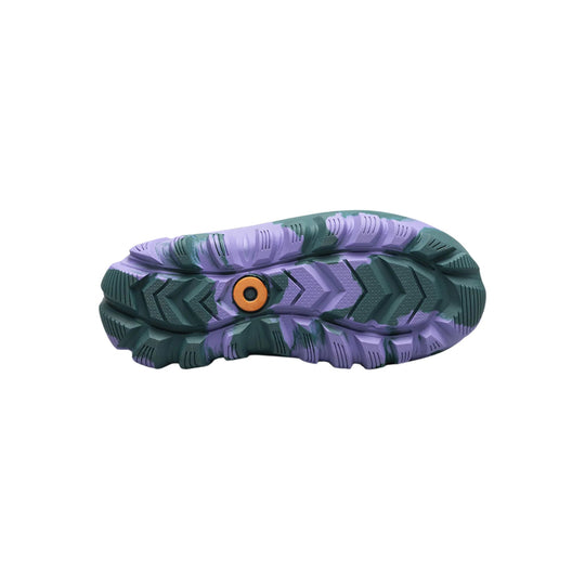 Purple and dark teal lugged boot sole with an orange circular insert