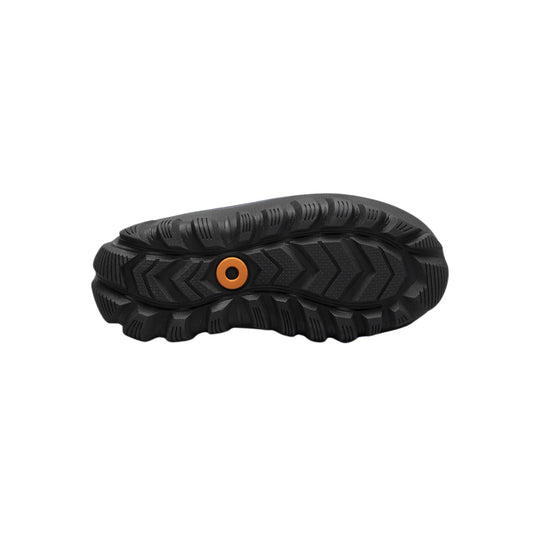 Black boot sole with deep traction lugs and orange circular insert