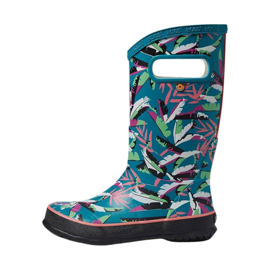 Teal kids rain boot with colorful leaf print, black sole, and pull handle