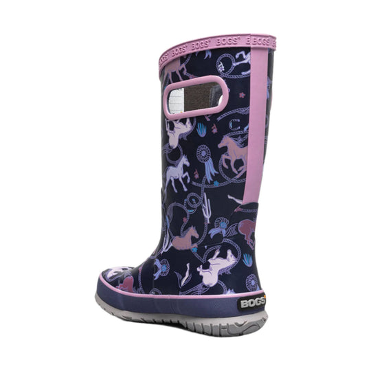 Tall navy rain boot with pink trim and horse print, shown in side view