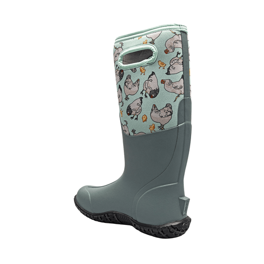 Tall mint-green rain boot with chicken print on the shaft and black treaded sole