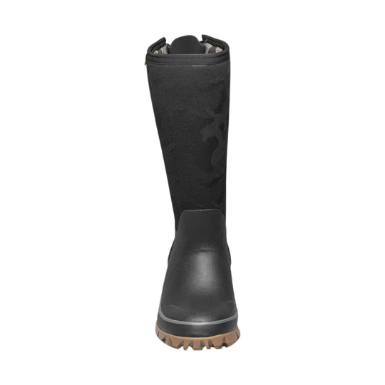 Black tall winter boot with camo-pattern shaft and tan lug sole, front view