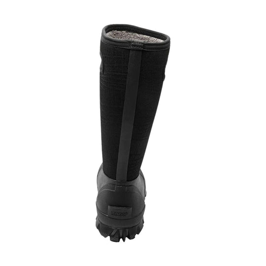 Black tall winter boot with a rubber lower, textured upper, and lugged sole, shown from the back
