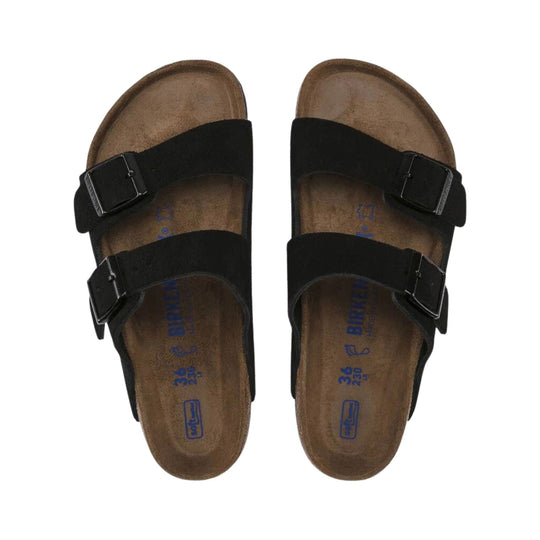 Pair of black two-strap sandals with cork footbeds, top view