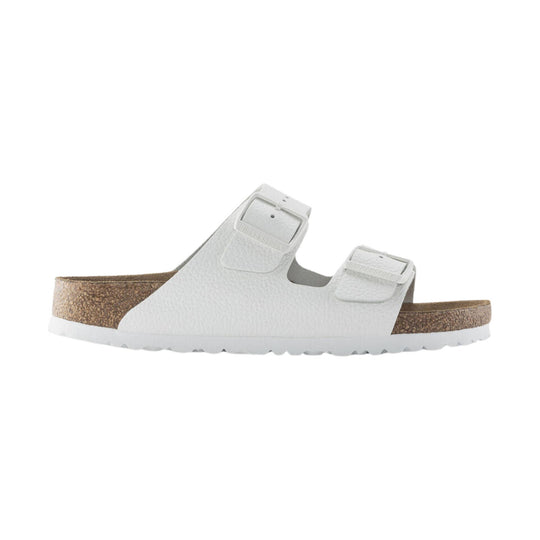 White two-strap slide sandal with cork footbed and white sole, shown in side view