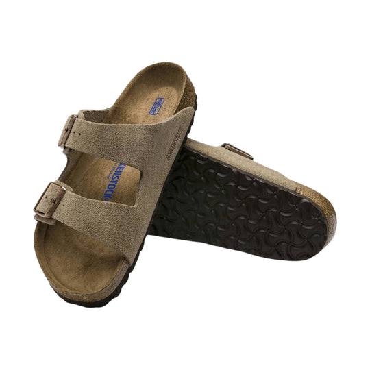 Tan suede two-strap sandal with cork footbed and dark treaded sole, shown from top and bottom