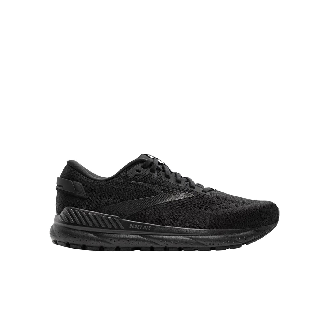 Black low-profile running shoe with knit upper, thick cushioned sole, and side branding