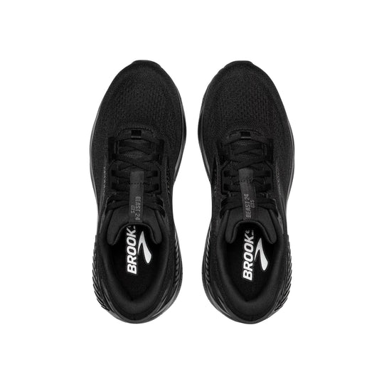 Black athletic shoes viewed from above with knit uppers, lace-up closures, and Brooks branding on the insoles.