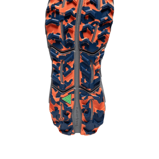 Trail shoe outsole with orange and navy tread and gray center strip