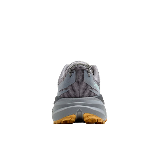 Gray trail running shoe with orange lugged outsole, shown from the back