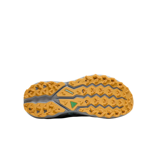 Trail running shoe outsole with gold lugs, gray midsole, and visible Brooks logo