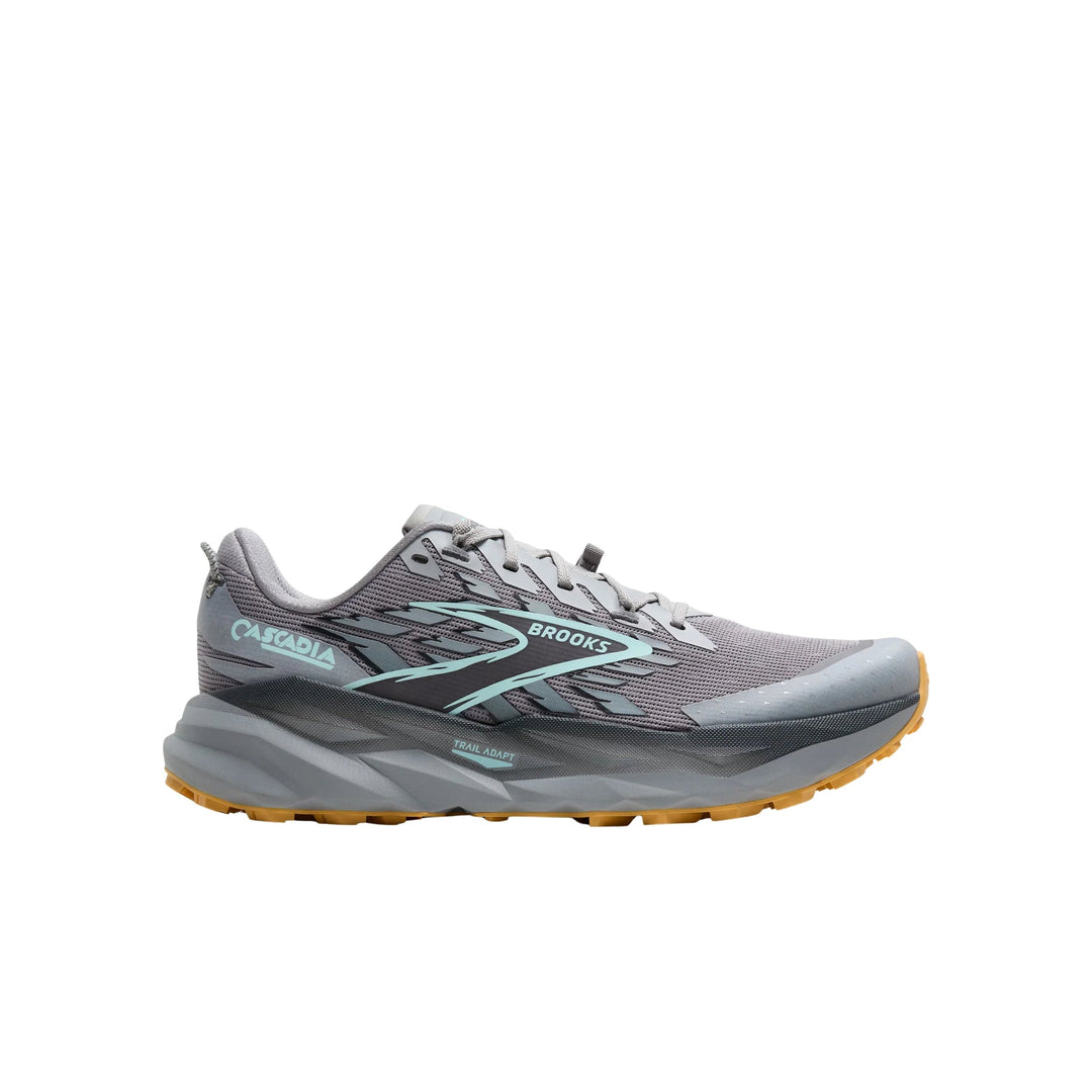 Gray trail running shoe with teal accents, lugged outsole, and side profile view