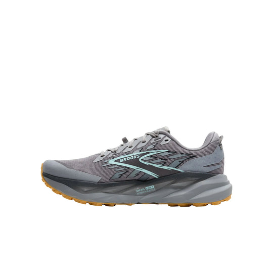 Gray trail running shoe with teal accents and a gum outsole, side view