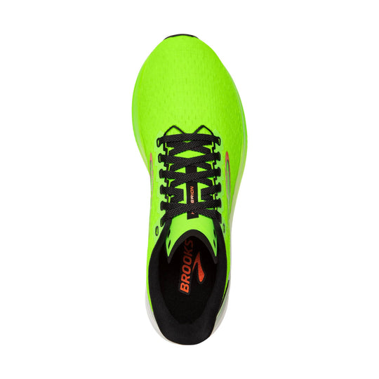 Neon green running shoe with black laces and orange Brooks branding