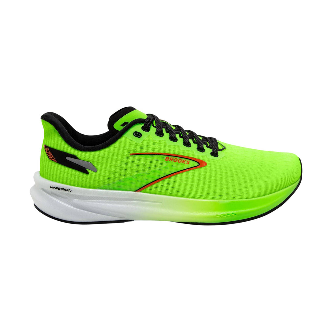 Neon green running shoe with black laces, white foam midsole, and orange side branding