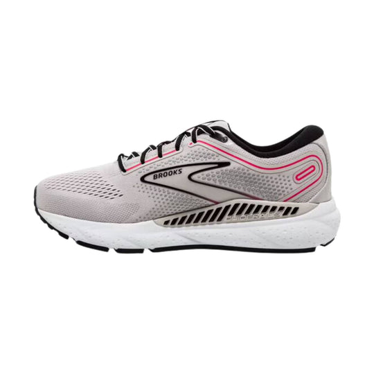 White running shoe with black laces and pink accents, side view