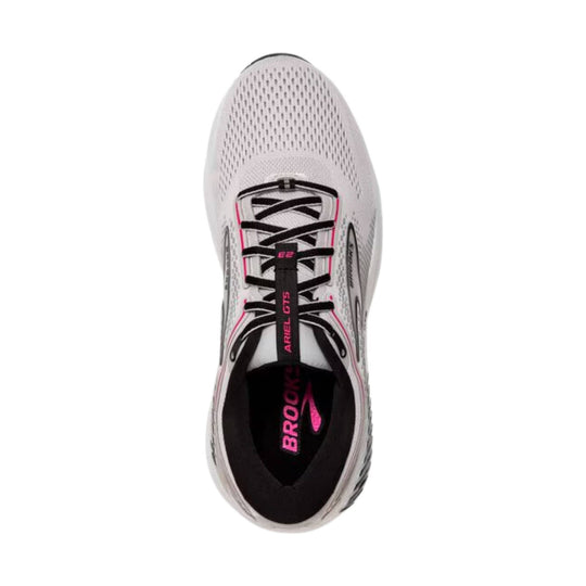 White running shoe with black laces, pink accents, and visible Brooks branding