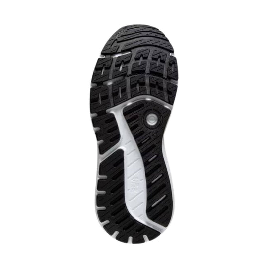 Black and white running shoe outsole with deep tread and a visible midfoot shank