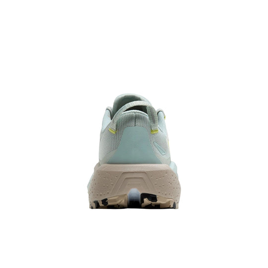 Light gray trail running shoe with a chunky beige sole, rear heel tab, and blue-green heel overlay