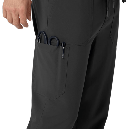 Black scrub pants with a side cargo pocket holding scissors and a pen