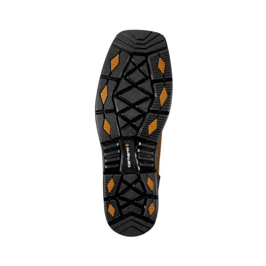 Black boot outsole with orange traction inserts and Carhartt logo
