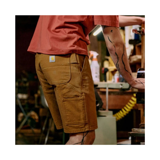 Brown utility work shorts with large cargo pockets and a small logo patch on the back waistband