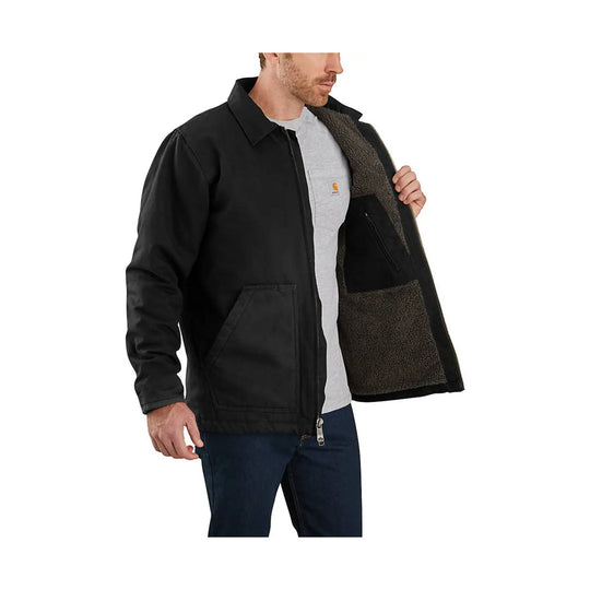Black canvas jacket with sherpa lining, flap pockets, and zip front, worn open over a gray T-shirt