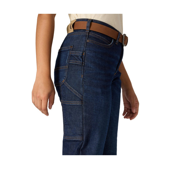 Dark wash denim carpenter jeans with contrast stitching, side utility pockets, and a brown belt