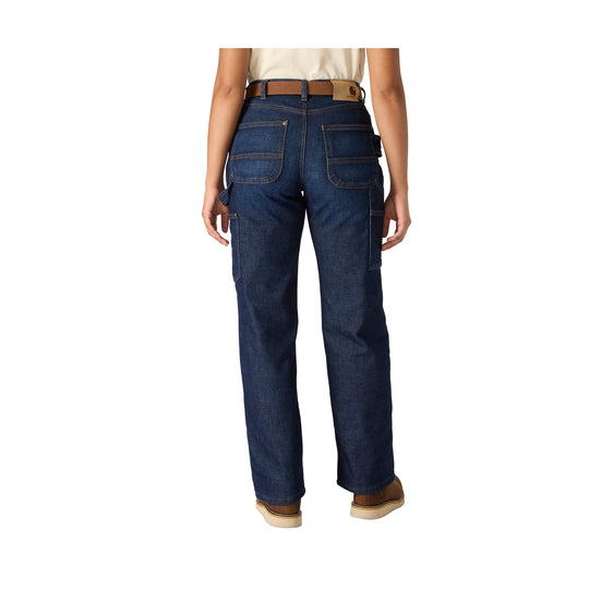 Back view of dark wash carpenter jeans with large rear pockets, utility loops, and tan work boots