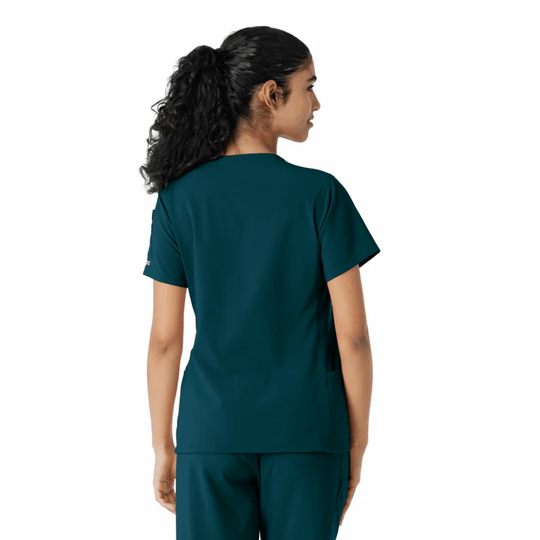 Teal short-sleeve scrub top shown from the back on a model