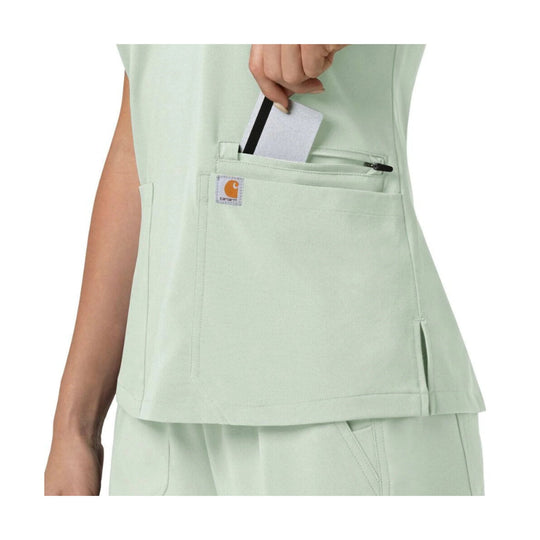 Mint green scrub top with chest and side pockets, shown with a card in the chest pocket